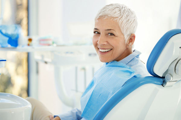 Woman smiling in a dental chair