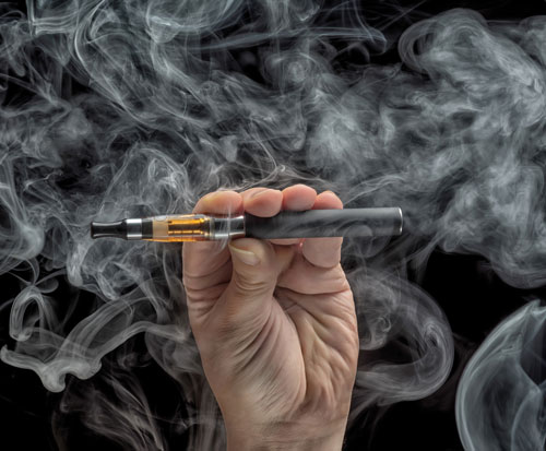 image of a hand holding an e-cigarette